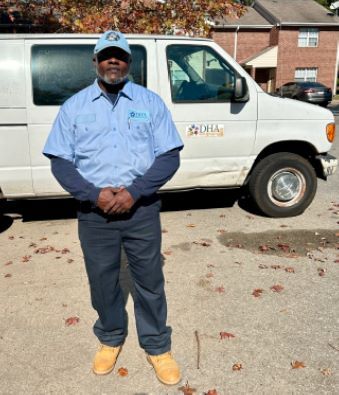 Alan Hamilton standing in front of a what Durham Housing van.