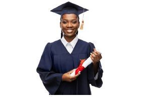 A woman in a graduation cap and gown holding a diploma.