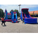 A blue and pink castle bounce house next to a blue and red blow-up slide.